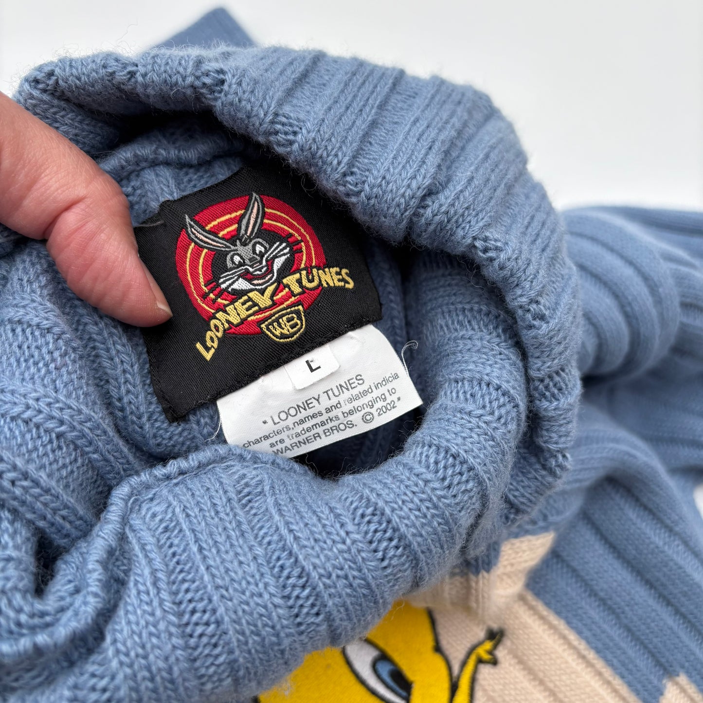 Titti pull azzurro a coste