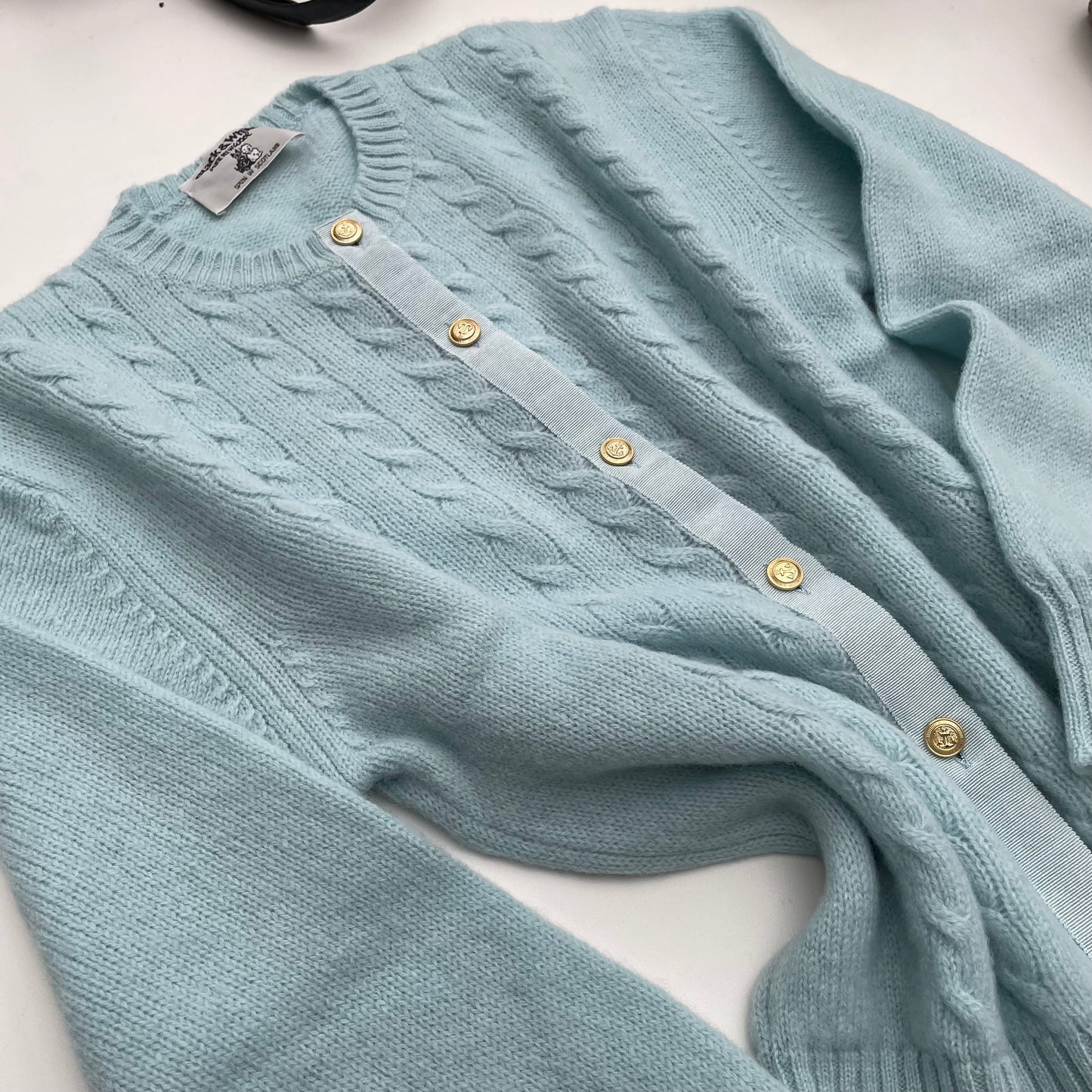 Cardigan azzurro baby lana shetland