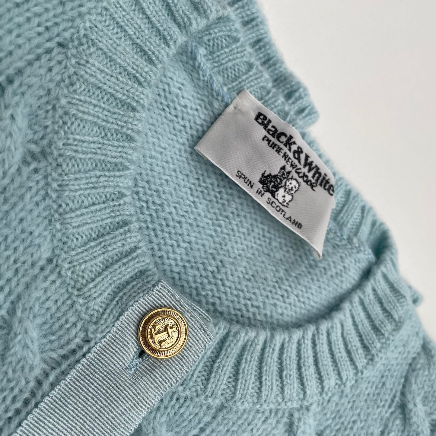 Cardigan azzurro baby lana shetland