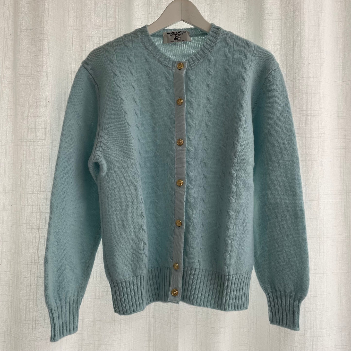Cardigan azzurro baby lana shetland
