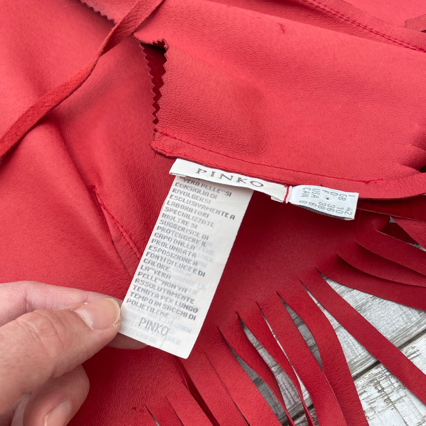Gilet rosso con frange