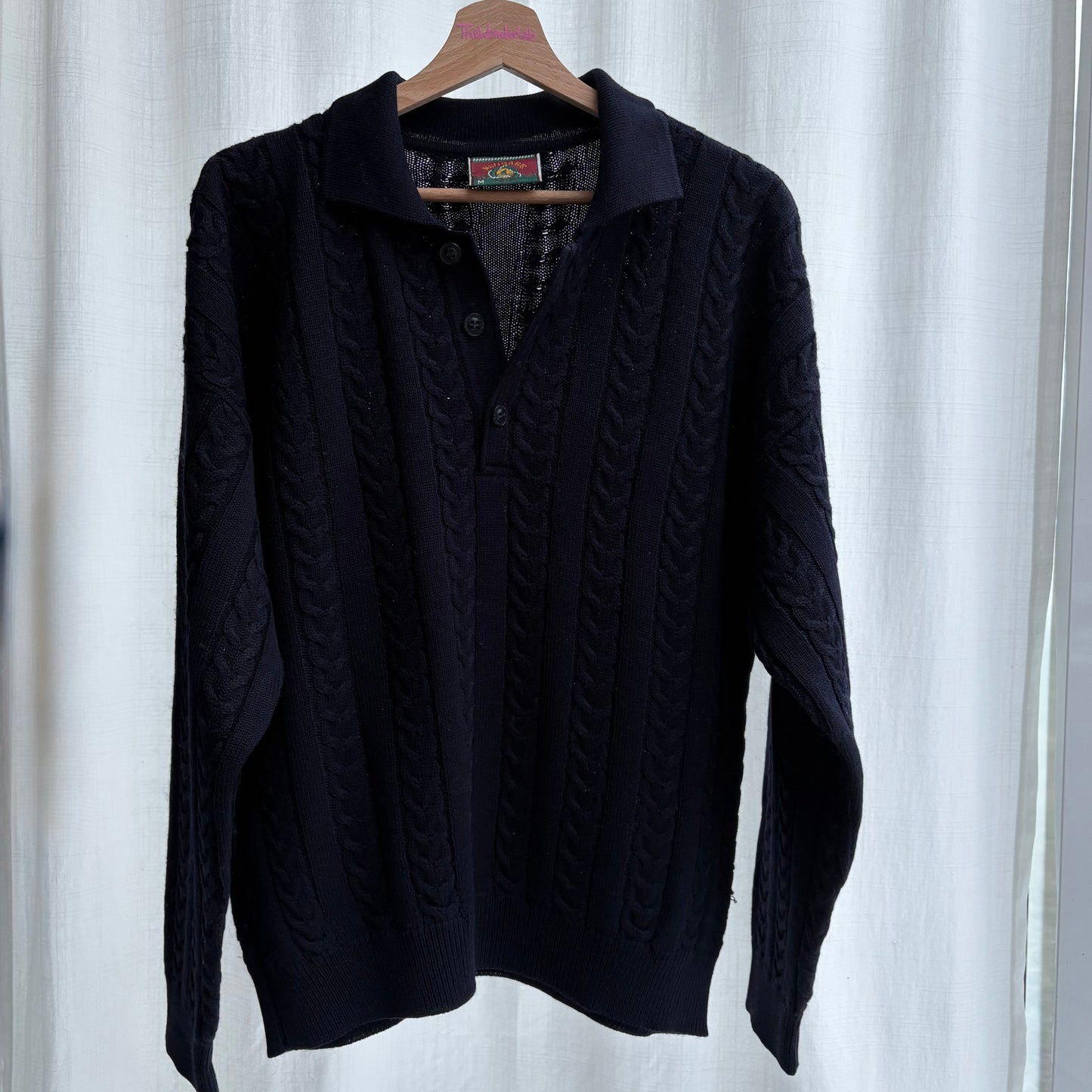 Polo in maglia a trecce