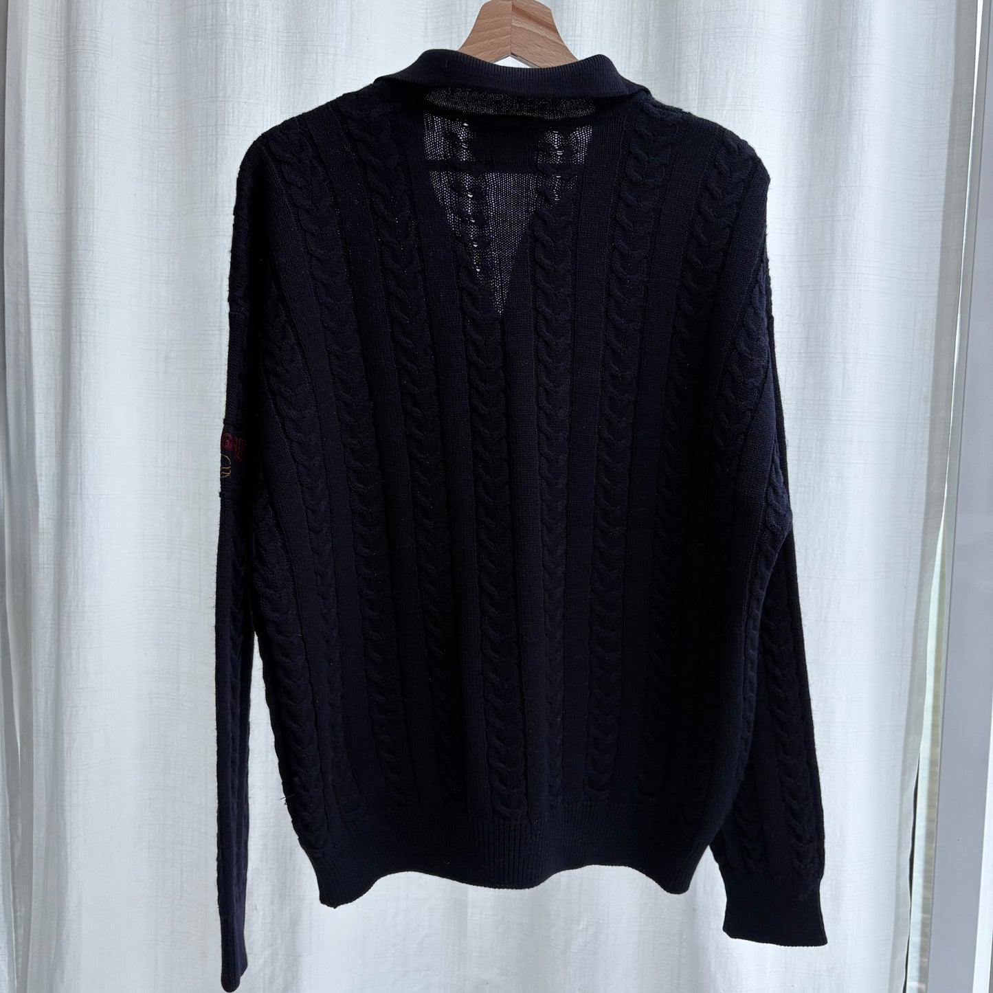 Polo in maglia a trecce
