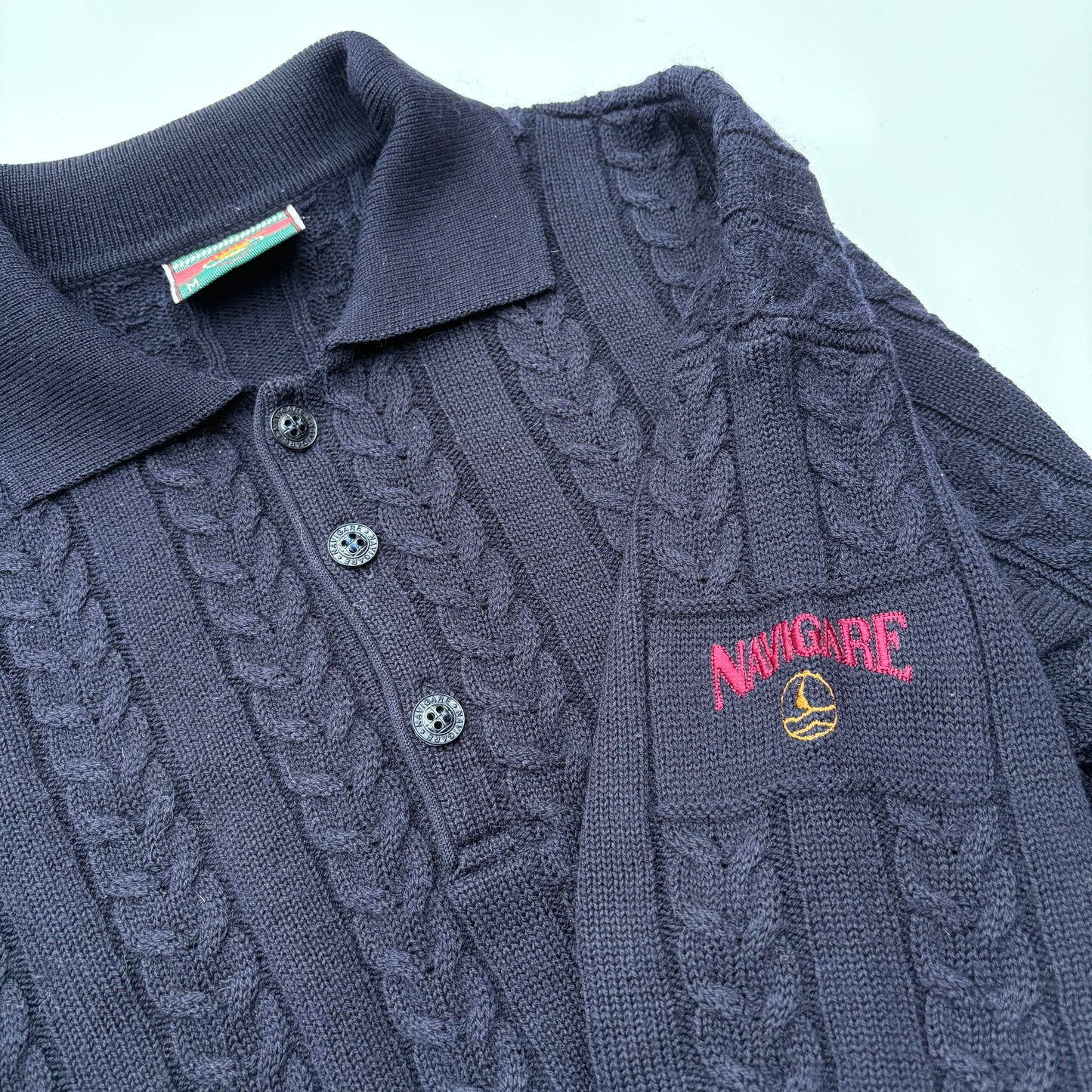 Polo in maglia a trecce