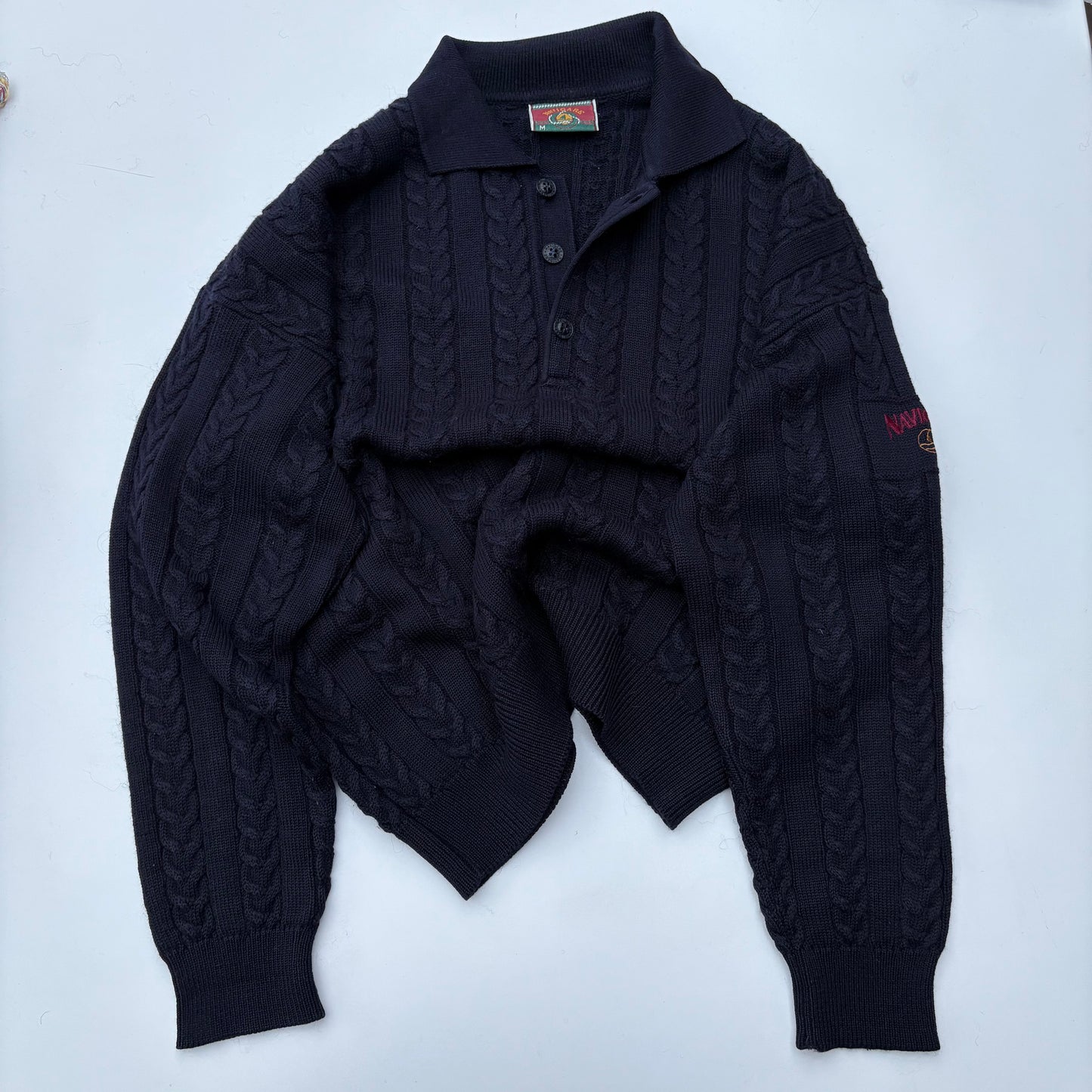 Polo in maglia a trecce